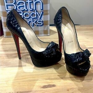 Christian Louboutin Black
Python Madame Butterfly Peep Toes